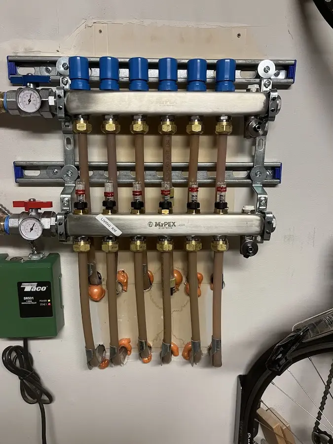 Plumber performing Water Heater Repair at a residential property in White Center